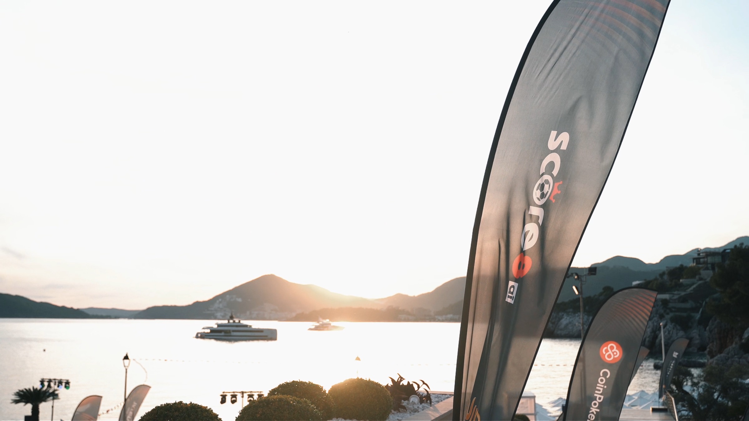 Score8 flags overlooking the Montenegro coast at sunset